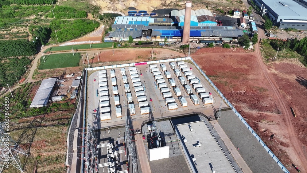 Fototapeta premium Aerial view of an industrial energy storage power station with battery arrays and supporting infrastructure