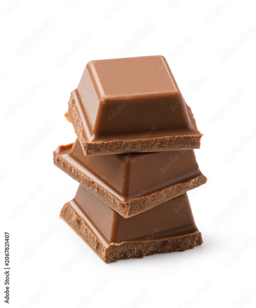 Fototapeta premium Milk chocolate pieces stacking on white background