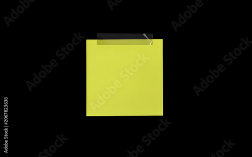 Yellow sticky note taped against a void symbolizing reminders and communication