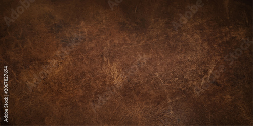 Photos A close-up shot showcases the rich texture and rugged grain of aged brown leather, hinting at quality craftsmanship and vintage appeal