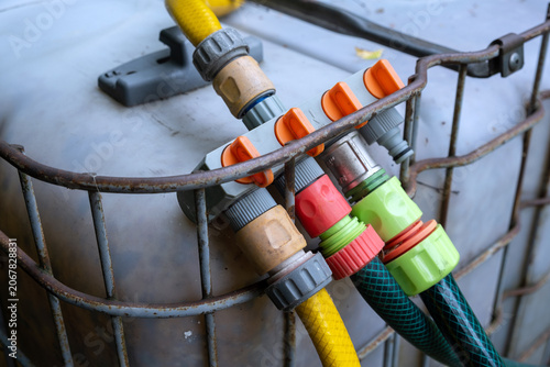 Water Distribution System with Garden Hoses and Storage Tank