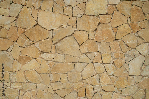 Yellow stone wall close up