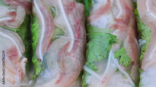 Fresh homemade vietnamese spring rolls with pork ear, vegetables, and rice noodles wrapped in translucent rice paper. Authentic asian appetizer prepared for a delicious and healthy meal