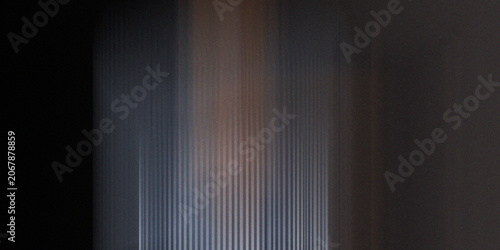 Vertical abstract background with streaks of grey, blue, and brown, textured and moody, modern digital art for design.