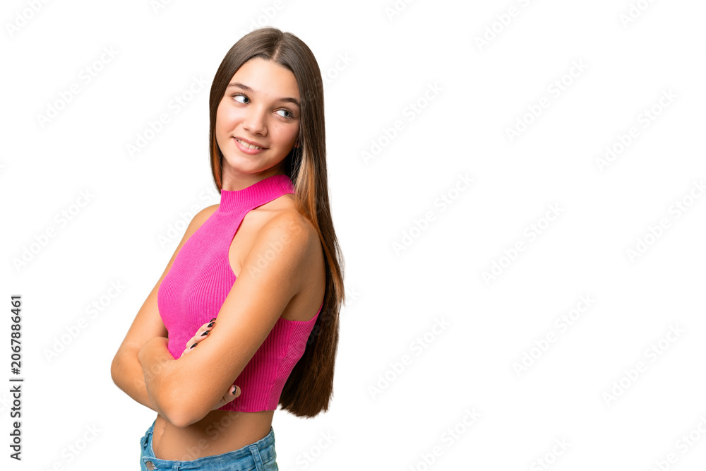 Fototapeta premium Teenager caucasian girl over isolated background with arms crossed and happy