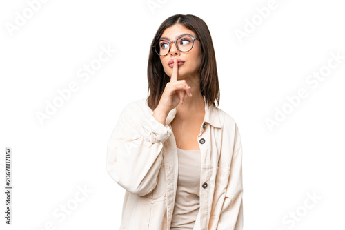 Obraz na płótnie Young Russian woman over isolated chroma key background showing a sign of silenc