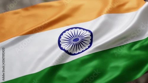 National flag of India waving with Ashoka Chakra on saffron white green stripes.