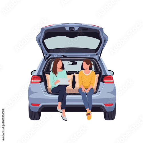 Two women sitting in the open trunk of a car