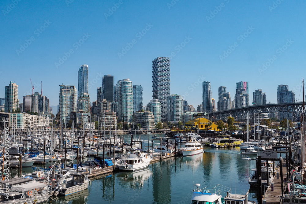 Fototapeta premium Vancouver Skyline and Marina with False Creek Waterfront and Modern High-Rise Buildings on a Sunny Day, British Columbia, Canada