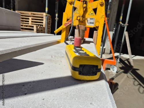 Принти на полотні A heavy-duty gantry crane load lifting attachment clamped onto a non-load-bearing partition wall at a construction or industrial site