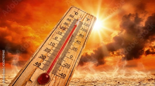 Scorching heatwave, global warming, wooden thermometer showing extreme warmth, intense sun, arid cracked land, climate emergency, severe drought