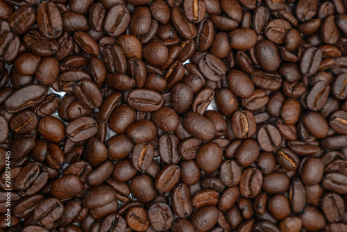 Horizontal full frame texture background of premium roasted coffee beans.