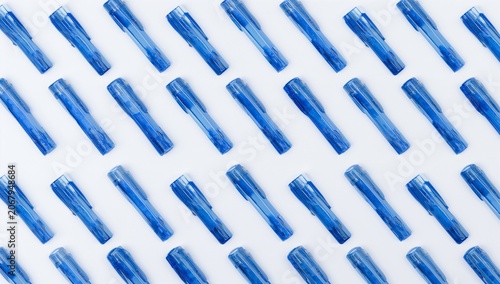 Multiple Blue Gel Pens Arranged Neatly on White Surface for Stationery or Office Supplies