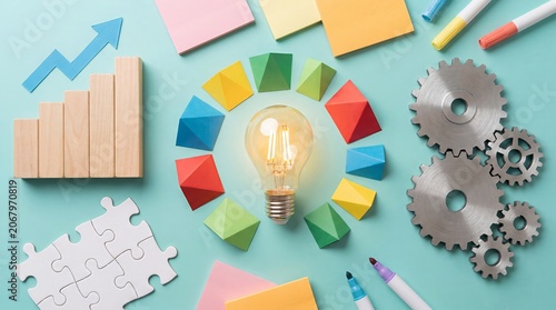 Conceptual innovation framework featuring a glowing light bulb surrounded by colorful interconnected segments. Represents strategic planning, idea development, innovation management, and creative proc