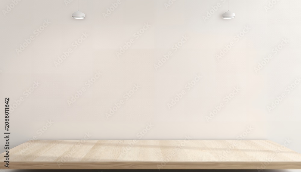 Fototapeta premium A light-colored wooden table against a plain white wall with two small white objects mounted on the wall above it