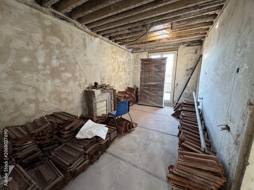 Interior renovation with stacked roof tiles and materials