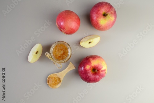 Top view of homemade apple jam with fresh apples and apple slices