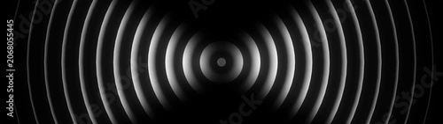 Abstract circular sound waves expanding from center in black and white circles radio signal frequency vibration circles radio signal frequency vibration