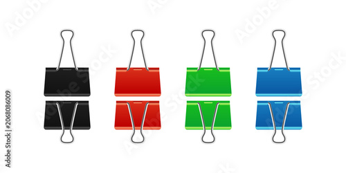 Set of four colorful metal binder clips in black, red, green, and blue arranged in two rows for office... isolated on a transparent background