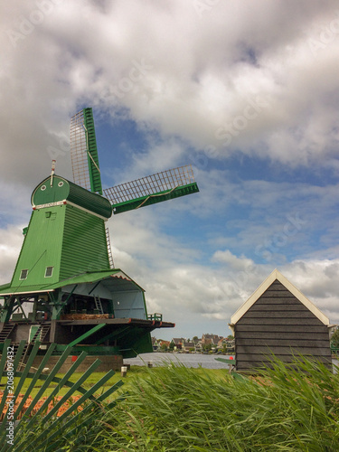 De Gekroonde Poelenburg Windmill (The Crowned Poelenburg). Traditional Dutch old wooden windmill in Zaanse Schans - museum village in Zaandam. The Netherlands.