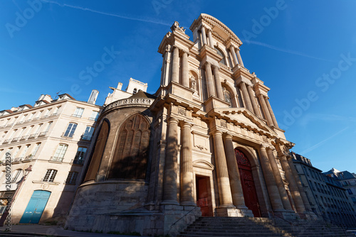 Imposing classical facade of the Saint-Gervais-Saint-Protais church in Paris, featuring monumental fluted Corinthian columns .