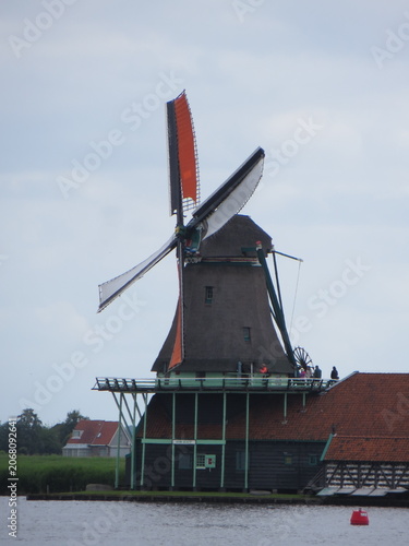 De Kat Windmill. Traditional Dutch old wooden windmill in Zaanse Schans - museum village in Zaandam. The Netherlands.