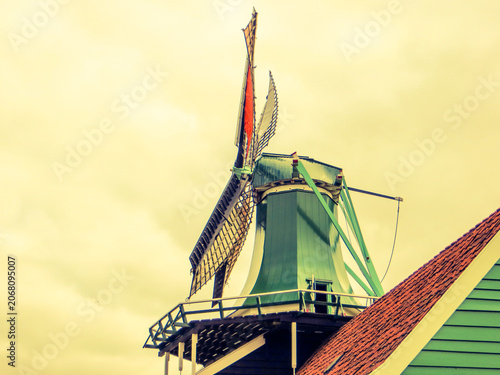 The windmill “De Huisman” (The Huisman). Traditional Dutch old wooden windmill in Zaanse Schans - museum village in Zaandam. The Netherlands.