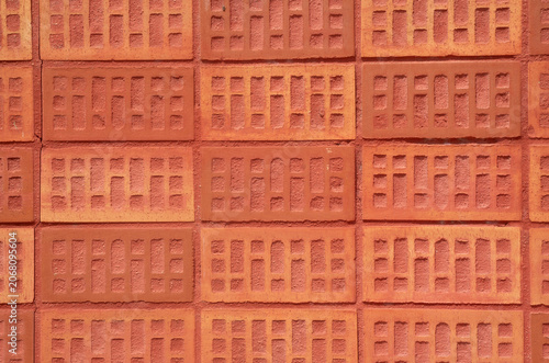 Red brick wall texture background closeup