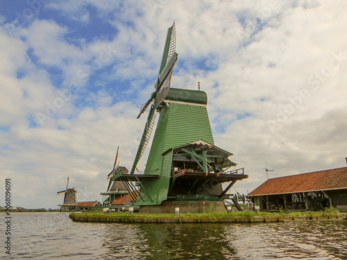 De Gekroonde Poelenburg Windmill (The Crowned Poelenburg). Traditional Dutch old wooden windmill in Zaanse Schans - museum village in Zaandam. The Netherlands.