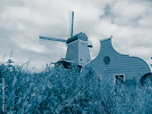 De Gekroonde Poelenburg Windmill (The Crowned Poelenburg). Traditional Dutch old wooden windmill in Zaanse Schans - museum village in Zaandam. The Netherlands.