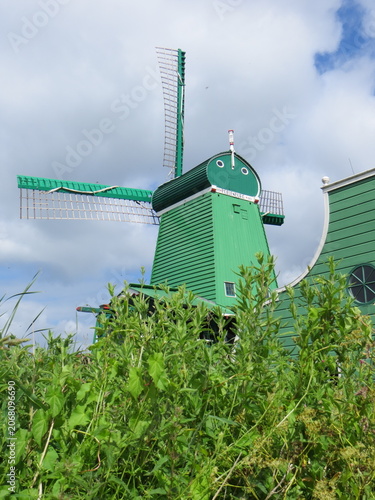 De Gekroonde Poelenburg Windmill (The Crowned Poelenburg). Traditional Dutch old wooden windmill in Zaanse Schans - museum village in Zaandam. The Netherlands.