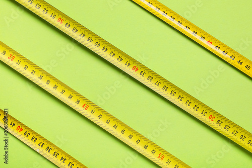 Yellow measuring tapes with...