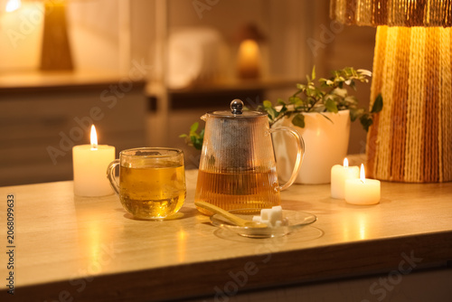 Cozy evening tea setting wi...