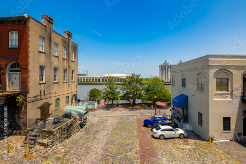 Fotografie Aerial photo Savannah Georgia historic industrial district by the river circa 20