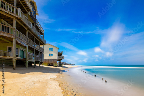 Bild auf Leinwand Beach homes on the outer banks of North Carolina being washed out