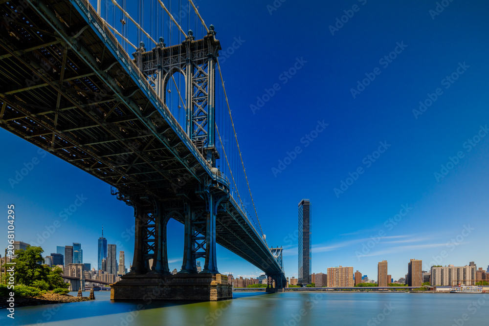 Fototapeta premium Under the Manhattan Bridge seen from Brooklyn 2026 long exposure photography