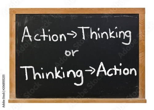 Fotografie Action then Thinking or Thinking then Action written in white chalk on a black c