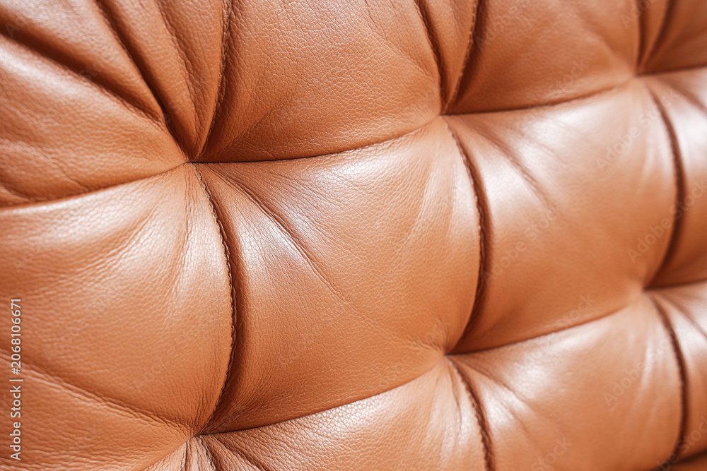 Fototapeta premium Brown tufted leather upholstery texture background, luxurious furniture material detail, elegant interior design surface