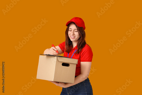 Smiling young delivery woma...