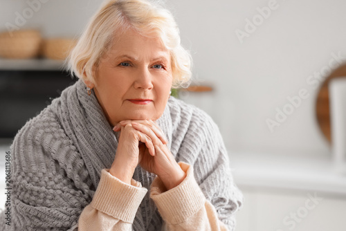 Thoughtful senior woman wit...