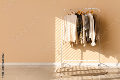 Rack with knitted sweaters ...