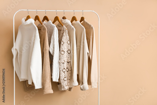 Rack with knitted sweaters ...