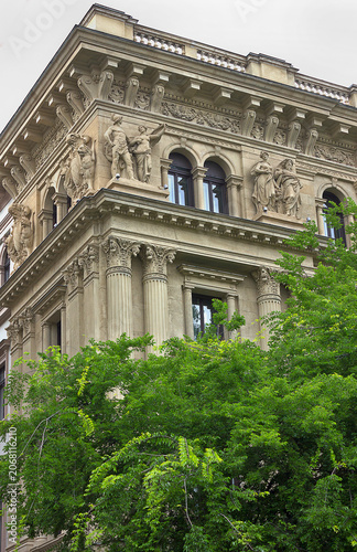 Corner of old house, decorated with sculptures and bas-relief.