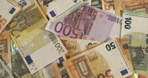 Close-up view of various Euro banknotes on a surface