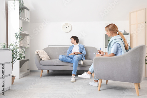 Teenage boy with mobile pho...