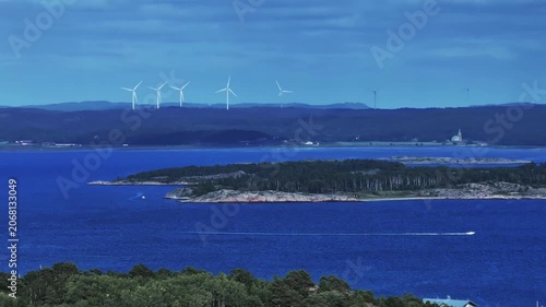 View of the sea and coastline with wind power plants