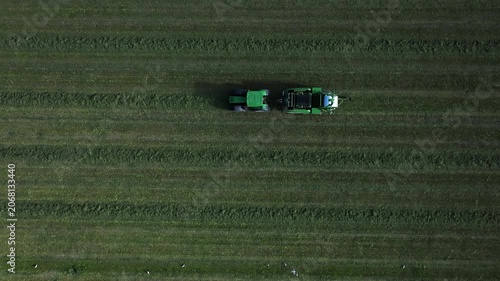 Tractor collects hay on the farm