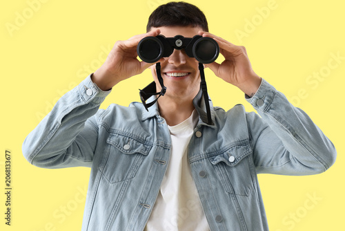 Young man looking through b...