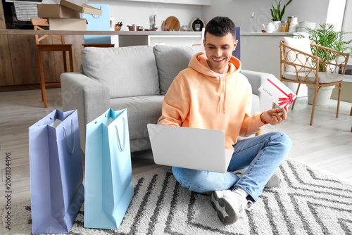 Young man with gift card an...