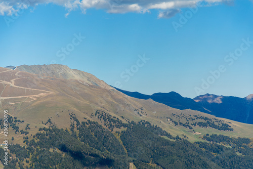 Horizontal distant caucasus mountain peaks under clear blue sky in Arkhyz Karachay Cherkessia Russia.